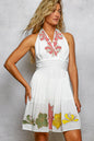 Ivory floral halter neck flowy dress by Trendsi, featuring a lightweight, elegant design with a fitted bodice and flowing skirt.