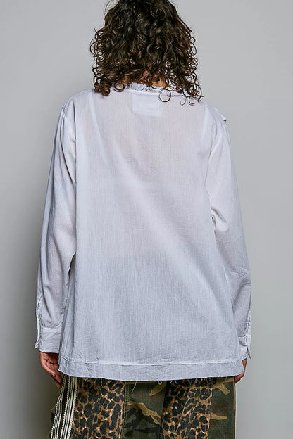 Ivory lightweight woven shirt by Trendsi with ruffle trim and round neckline, perfect for casual or dressy occasions.