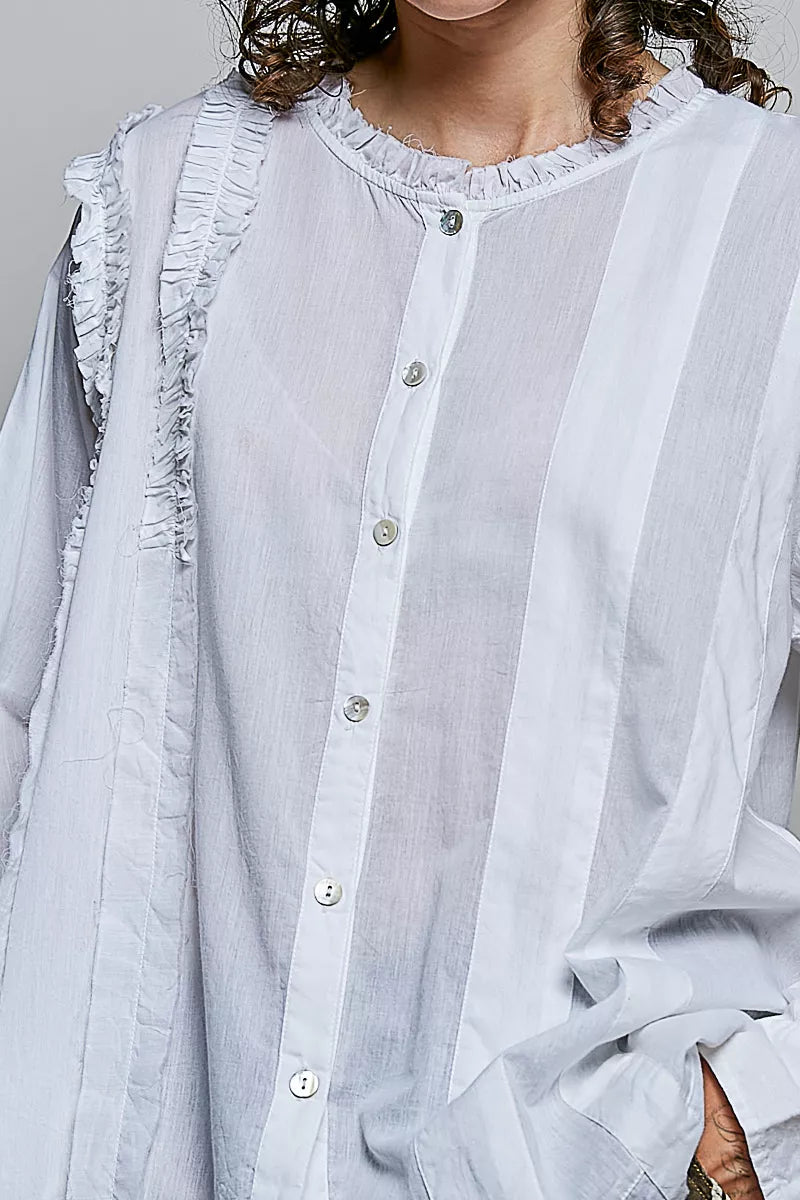 Ivory lightweight woven shirt with ruffle trim and round neckline by Trendsi, stylish and comfortable for casual wear.