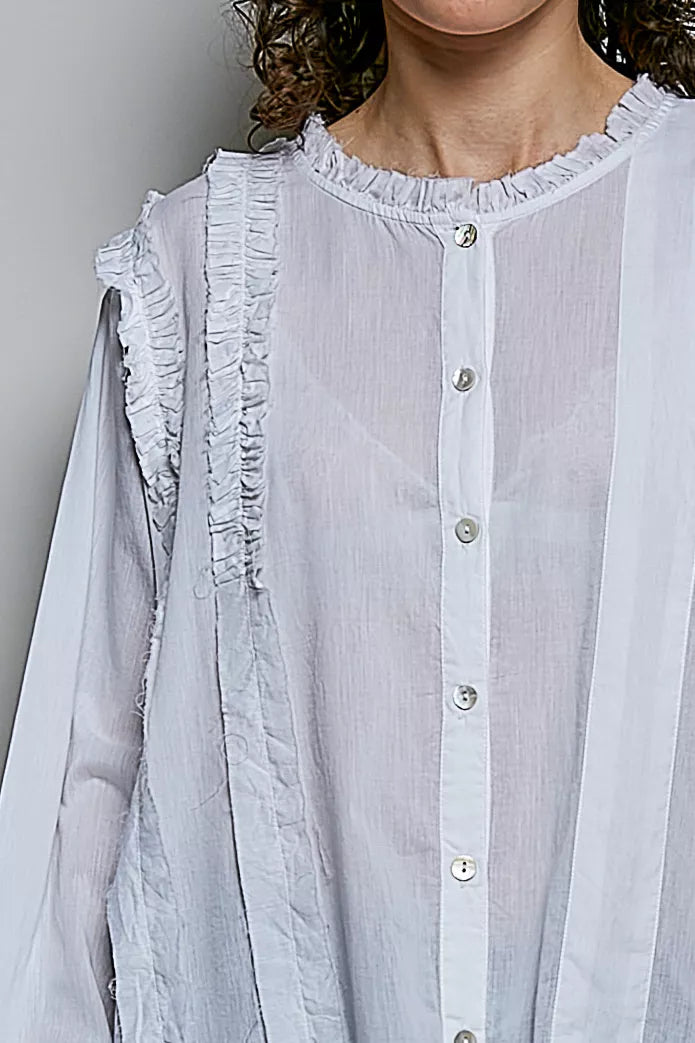 Ivory lightweight woven shirt with ruffle trim and round neck from Trendsi, styled for a casual or chic look.