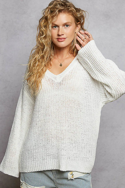 Ivory oversized V-neck knit top by Trendsi, featuring a relaxed fit and soft knit fabric, ideal for casual or layered outfits.