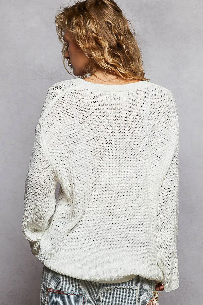 Ivory oversized V-neck knit top by Trendsi, featuring a relaxed fit and soft texture, perfect for casual or layered outfits.