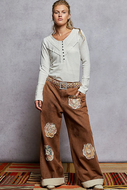 Ivory POL ribbed half-button knit top with lace detail from Trendsi, showcasing a close-up of the textured fabric and button accents.