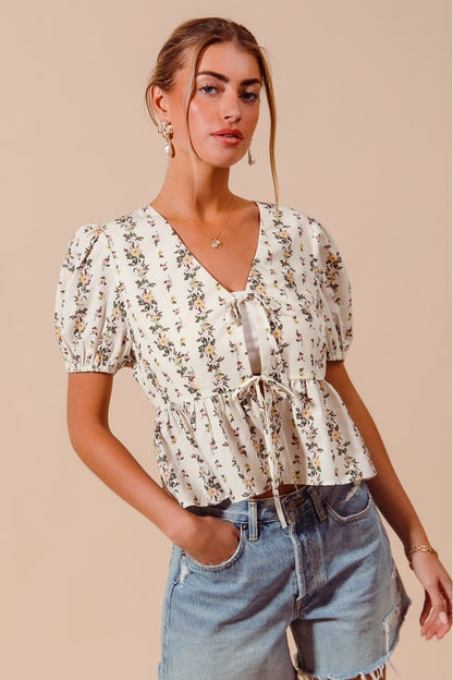 Ivory floral print tie-front blouse with shirred hem by SO ME, perfect for casual and stylish looks.
