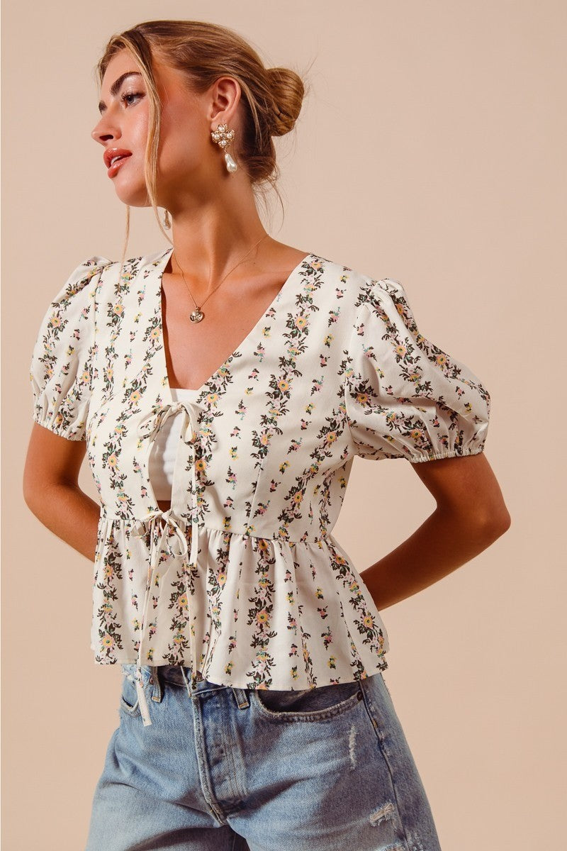 Ivory floral print tie-front blouse with shirred hem, trendy women's top by Trendsi.