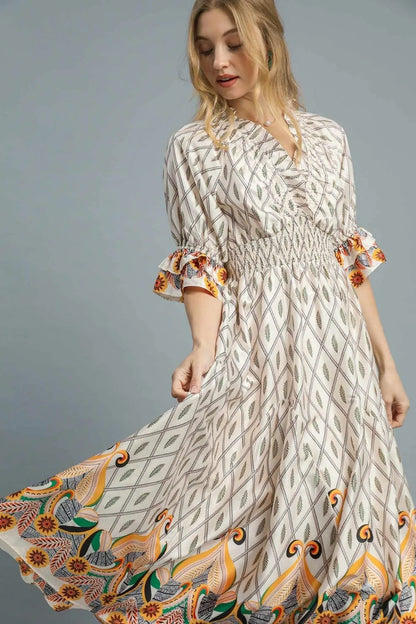 Ivory Umgee printed midi dress with smocked waist and flounce sleeves, stylish and flowy for a casual or dressy look.