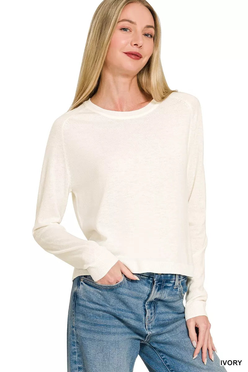 Ivory Zenana lightweight wool blend round neck sweater by Trendsi, featuring a cozy, fitted design with long sleeves.