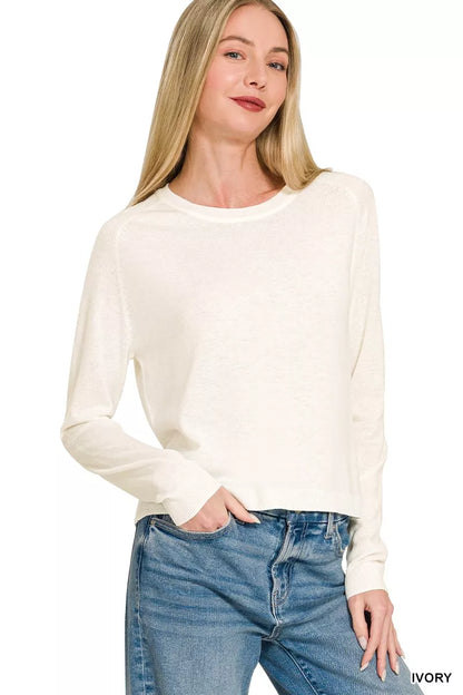Ivory Zenana lightweight wool blend round neck sweater by Trendsi, featuring a cozy, fitted design with long sleeves.