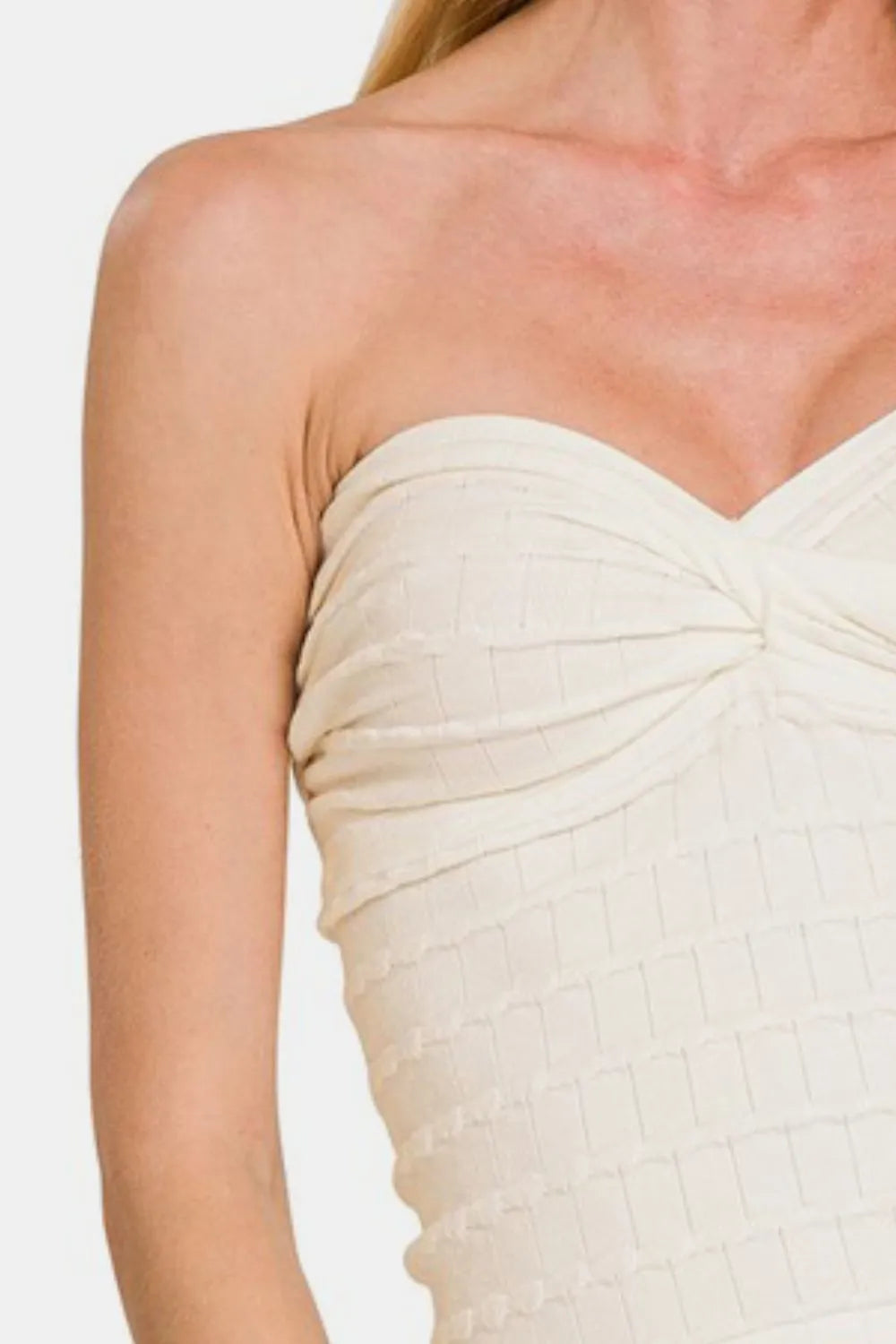 Ivory Zenana ruched twisted sweetheart neck top by Trendsi, close-up of the fitted, gathered fabric and twisted neckline design.