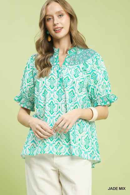 Umgee boho puff sleeve smocked top with mixed fabric and relaxed fit, featuring a stylish, casual design for trendy looks.