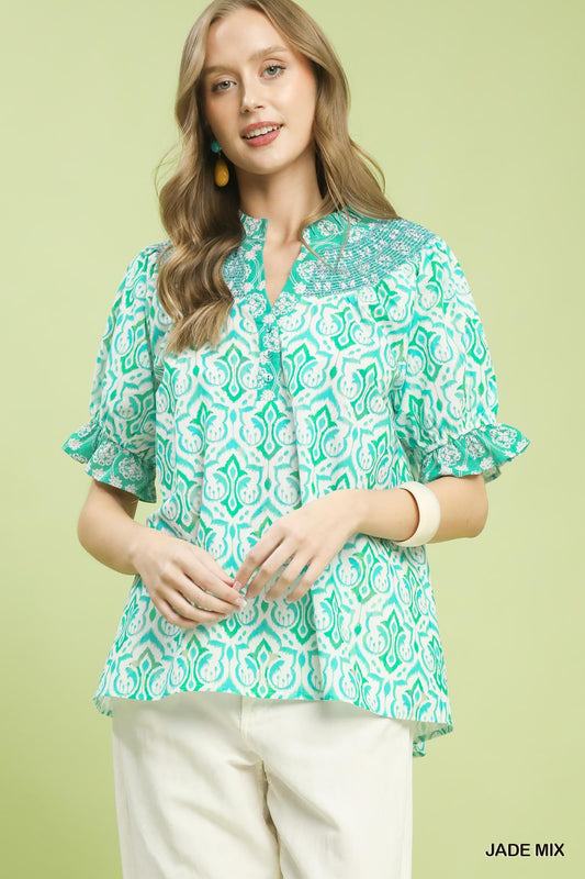 Umgee boho puff sleeve smocked top with mixed fabric and relaxed fit, featuring a stylish, casual design for trendy looks.