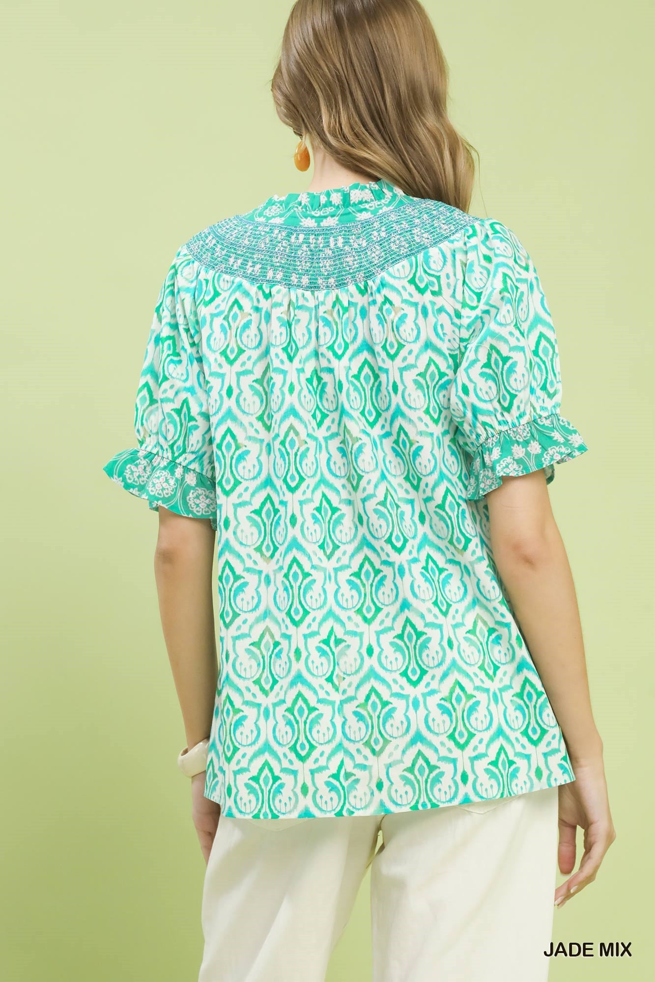 Trendsi Umgee Mix Boho puff sleeve smocked top featuring a relaxed fit and bohemian style, shown on a model.
