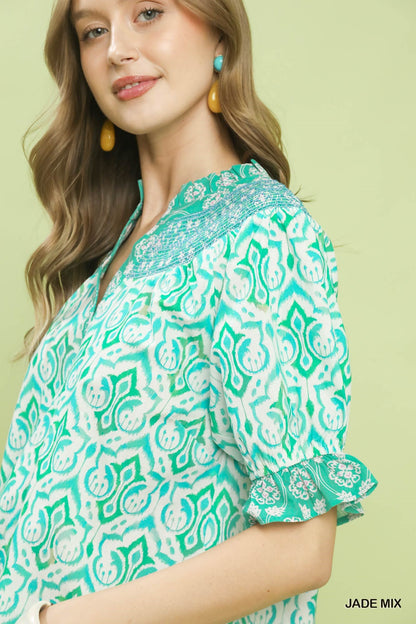 Trendsi Umgee Mix boho puff sleeve smocked top in jade with ruffled neckline and relaxed fit, styled on a model.