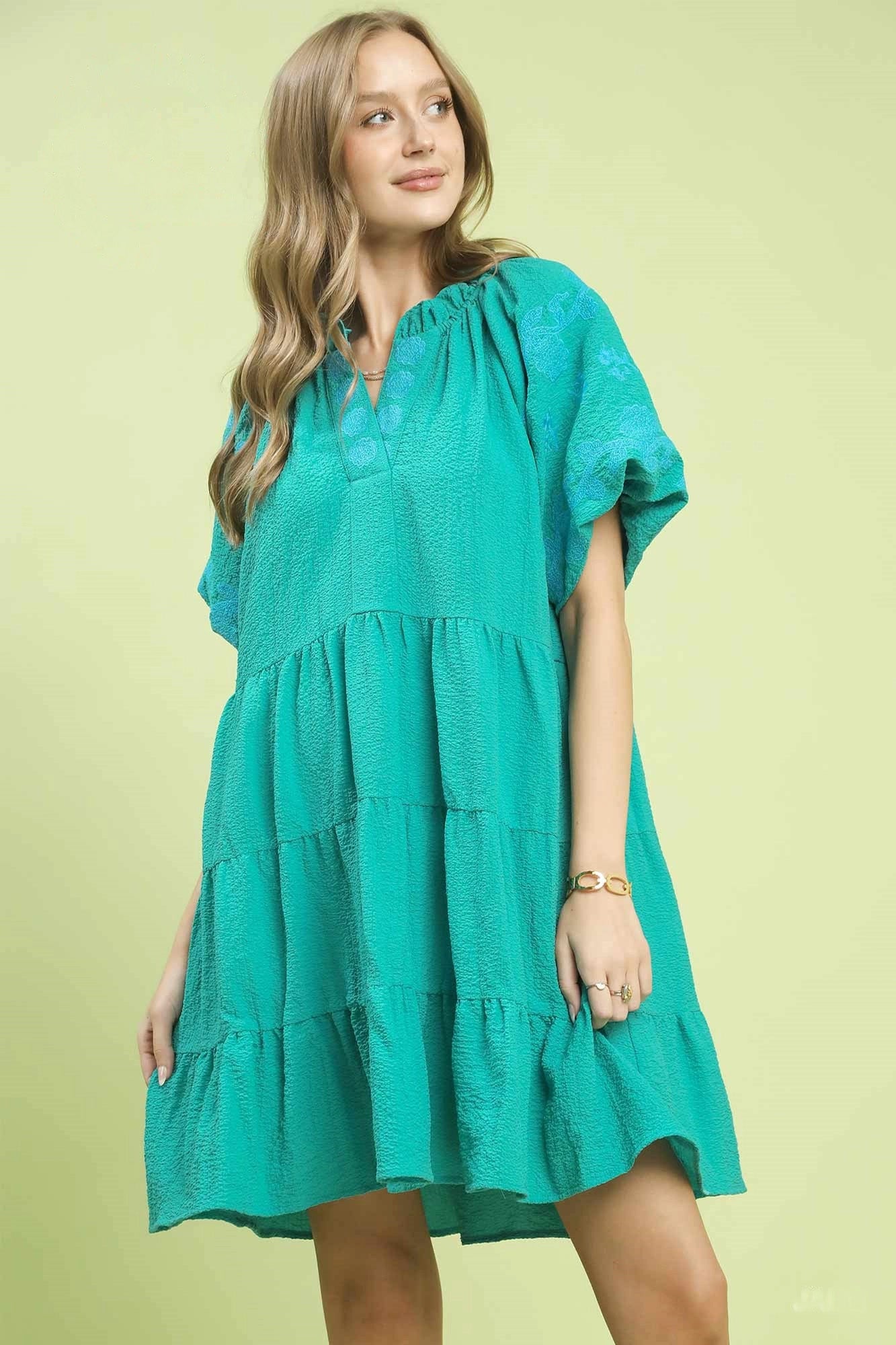 Umgee embroidered tiered puff sleeve mini dress by Trendsi, featuring intricate embroidery and a stylish tiered silhouette.