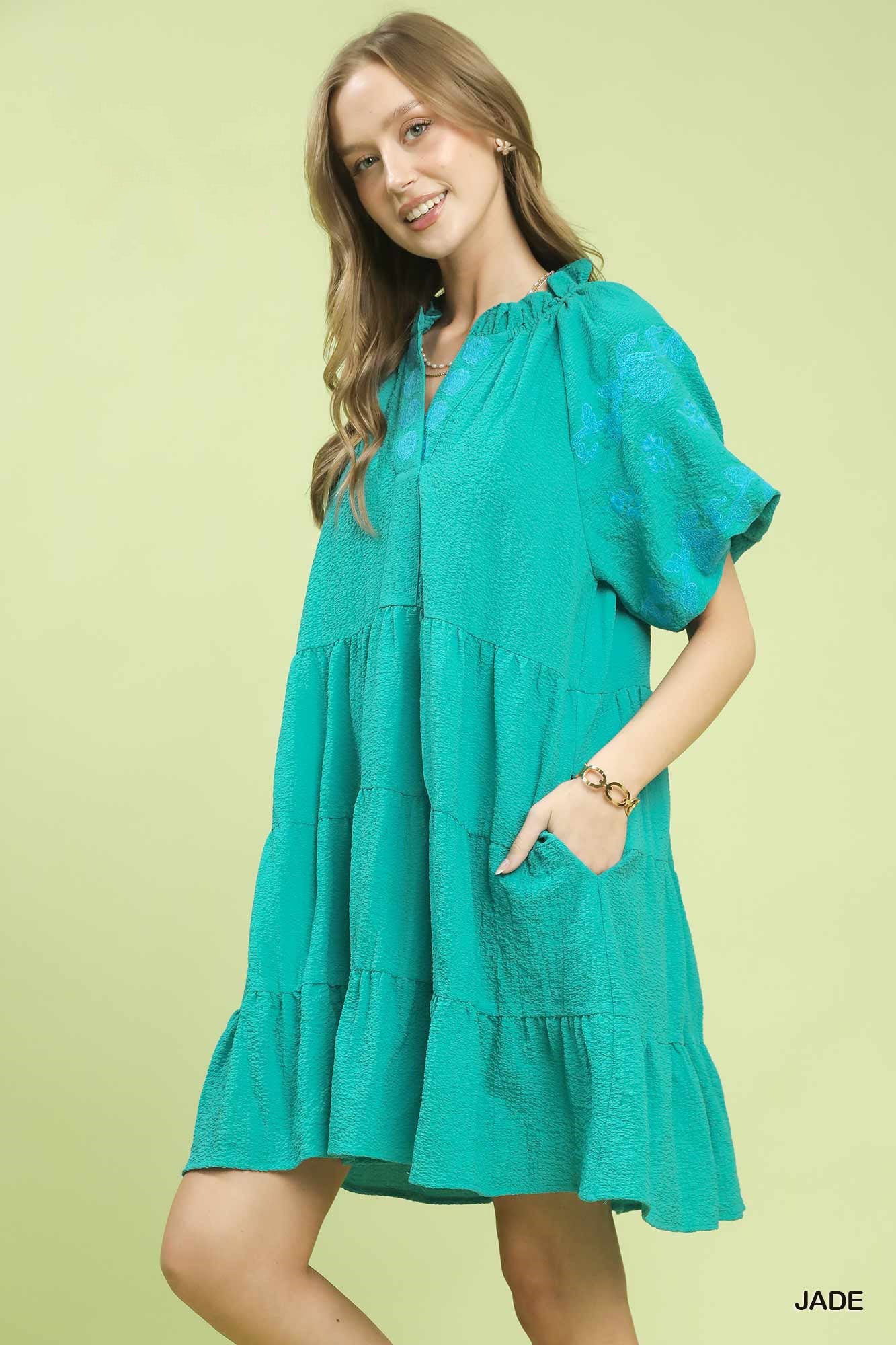 Umgee embroidered tiered mini dress with puff sleeves, featuring intricate embroidery and a stylish, feminine silhouette.