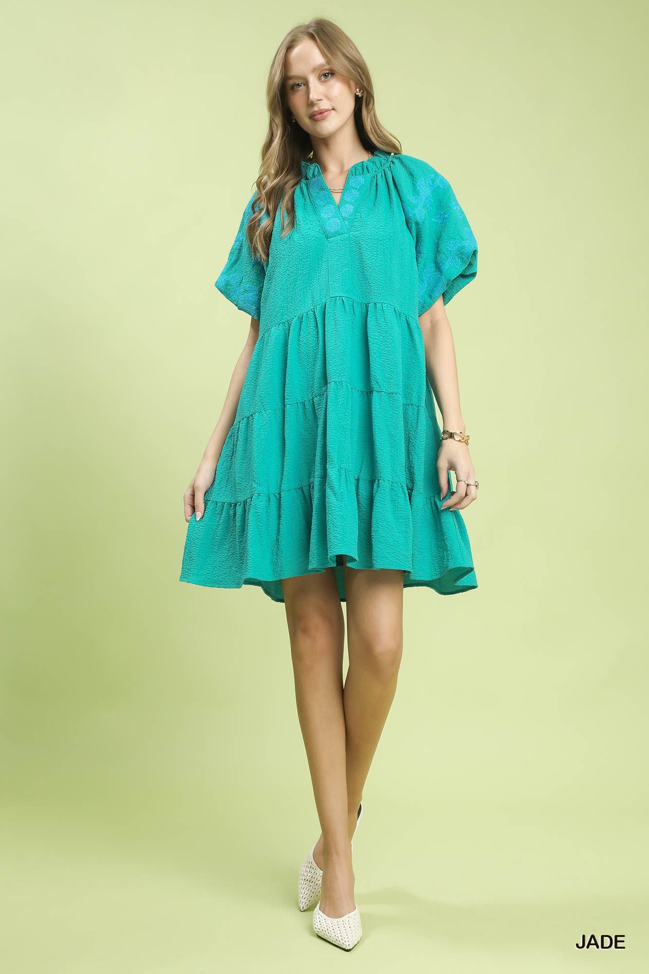 Umgee embroidered tiered puff sleeve mini dress in light fabric with floral embroidery and ruffled hem, perfect for casual wear.