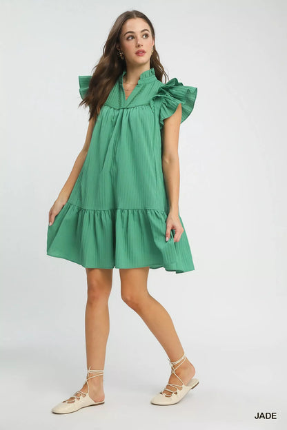 Pink Umgee Flutter Sleeve Tiered Dress by Trendsi, featuring flowing layers and flutter sleeves, ideal for casual or summer wear.