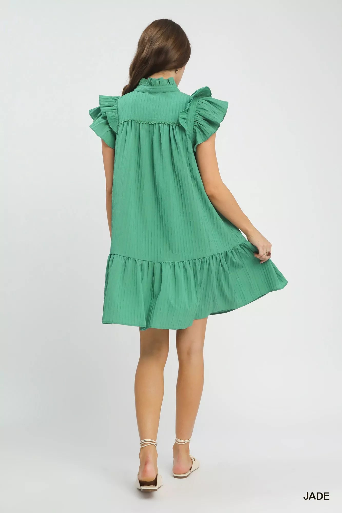Umgee Flutter Sleeve Tiered Dress featuring layered fabric and a relaxed fit, perfect for casual or semi-formal wear.