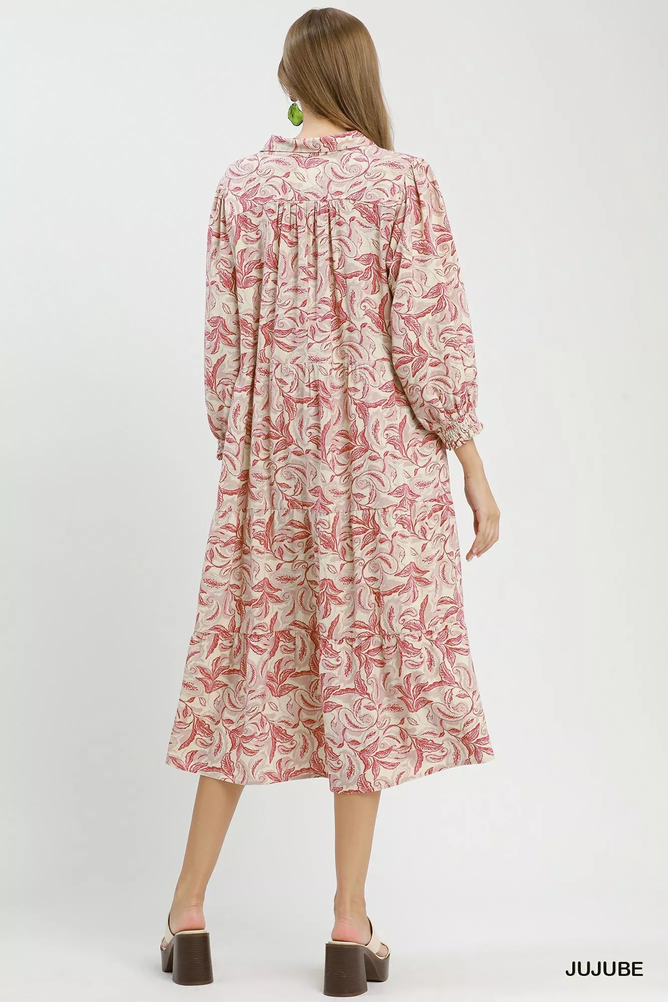 Umgee linen botanical print tiered midi dress with adjustable straps and flowy silhouette on a model.