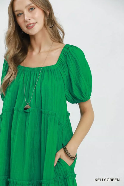Kelly green Umgee textured tiered midi dress with a relaxed fit and layered design, perfect for casual or dressy occasions.