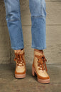 Khaki East Lion Corp lace-up lug booties with chunky soles and metal eyelets, stylish ankle boots from Trendsi.