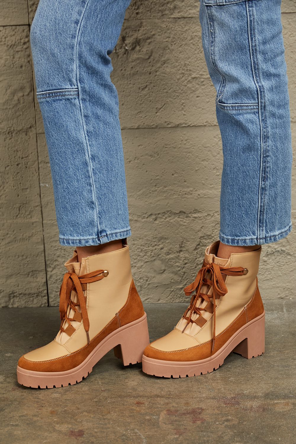 Khaki East Lion Corp lace-up lug booties with chunky soles and rugged style, perfect for casual and outdoor wear.