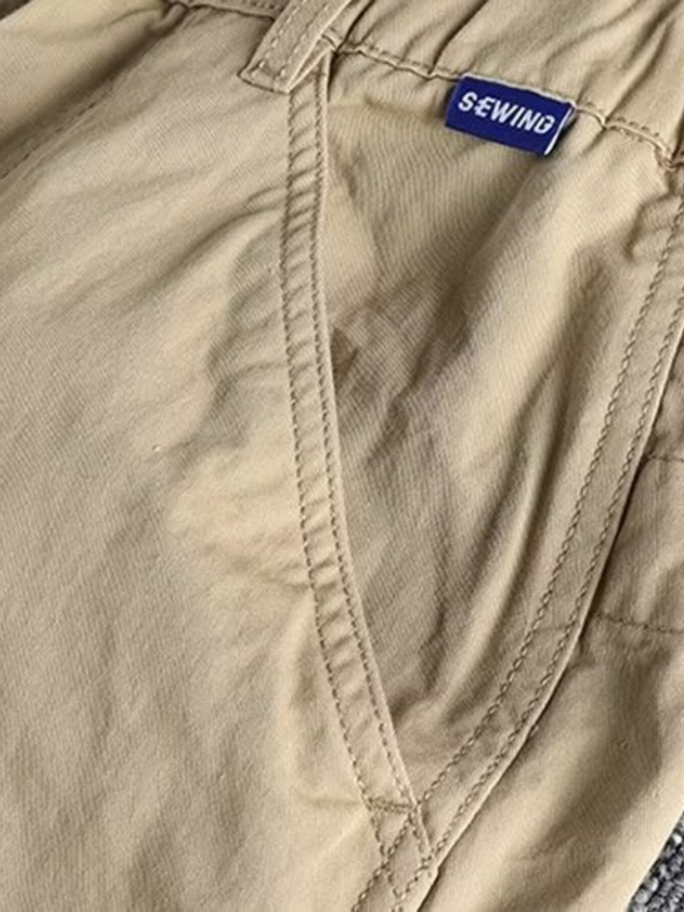 Men's plus size casual cargo pants with elastic waist in khaki, featuring multiple pockets and comfortable fit from Trendsi.