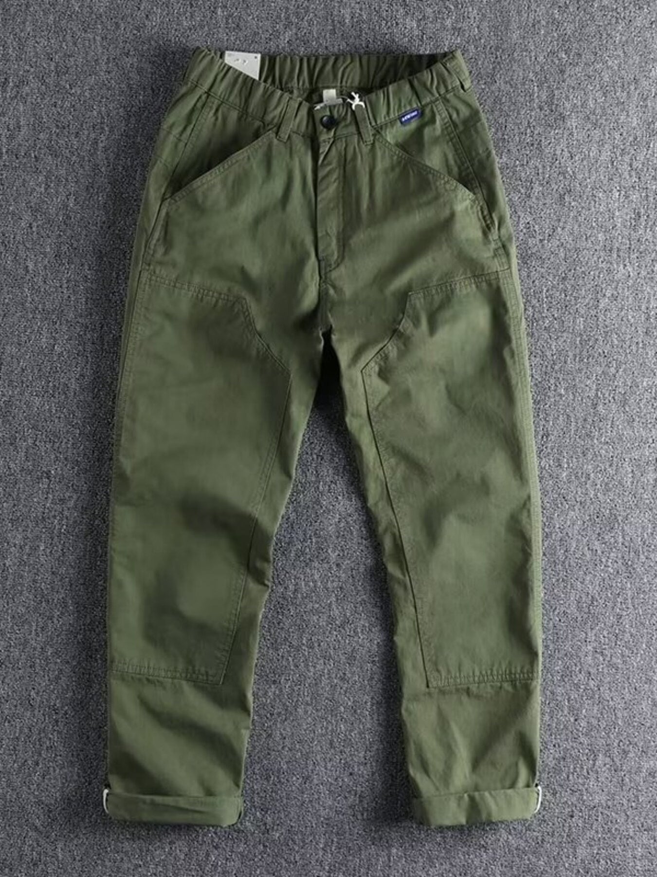 Men's plus size casual cargo pants with elastic waist in khaki color, featuring multiple pockets and relaxed fit from Trendsi.