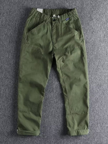 Men's plus size casual cargo pants with elastic waist in khaki color, featuring multiple pockets and relaxed fit from Trendsi.