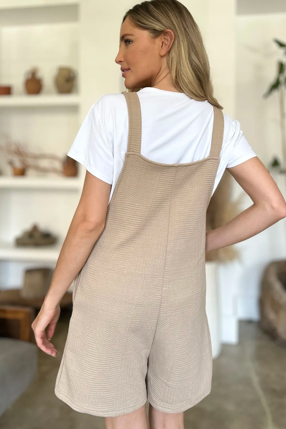 Khaki sleeveless romper from Trendsi, featuring a textured full-size design and a sleeveless style for casual wear.