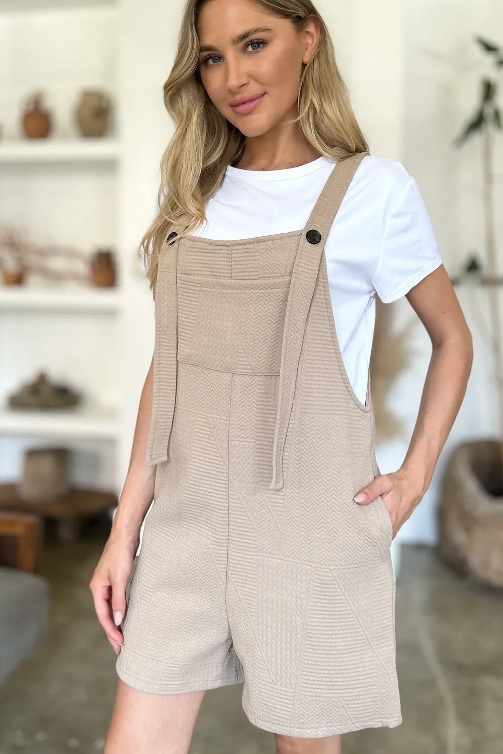Khaki sleeveless romper with textured fabric, full-size fit, from Trendsi, featuring a stylish, casual design perfect for warm weather.