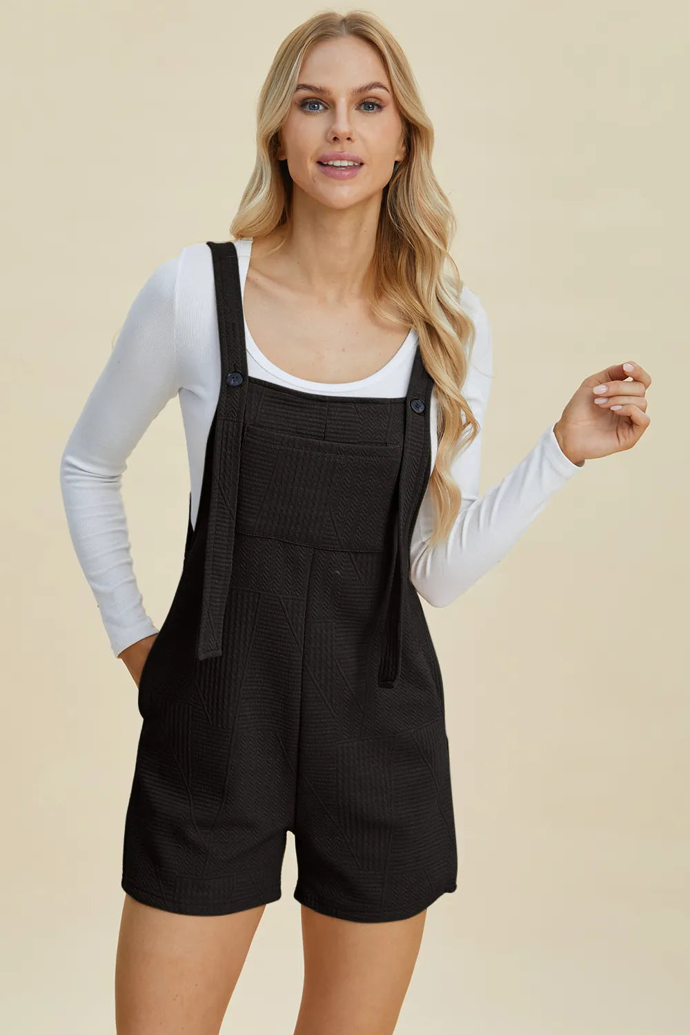 Khaki sleeveless romper with textured fabric, featuring a full-size fit and stylish design by Trendsi.