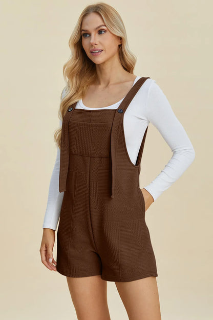 Khaki double take full-size texture sleeveless romper by Trendsi, featuring a stylish sleeveless design and textured fabric.