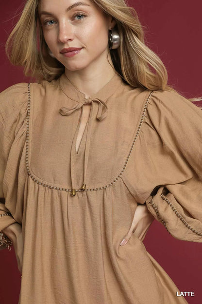 Umgee boho peasant mini dress with trim detail, featuring a flowy silhouette and casual bohemian style perfect for summer wear.