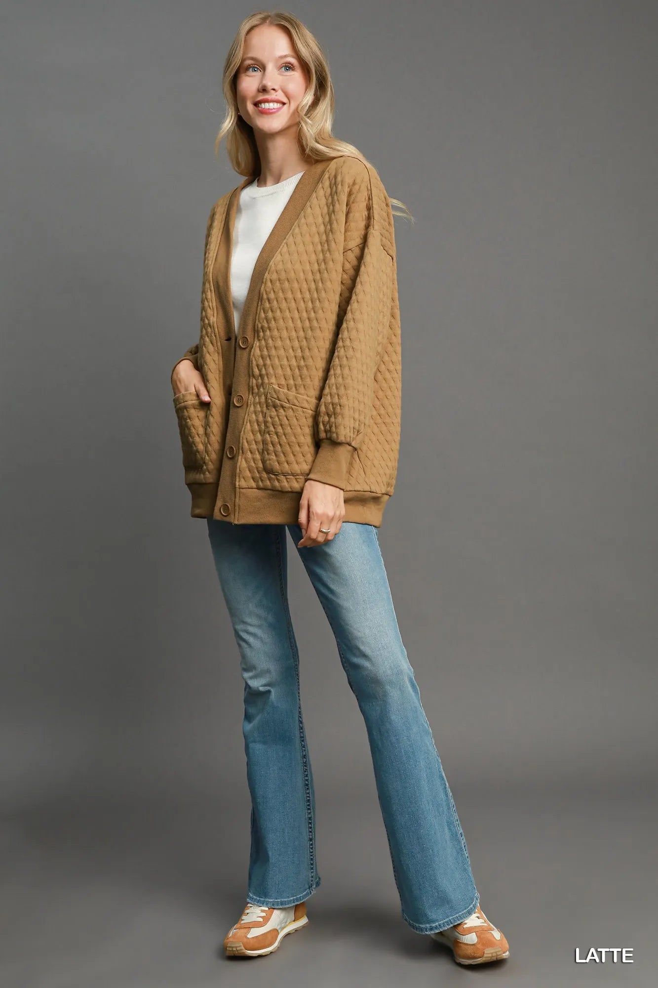 Latte-colored Umgee button-up jacquard cardigan with intricate knit pattern, styled for a cozy, casual look.
