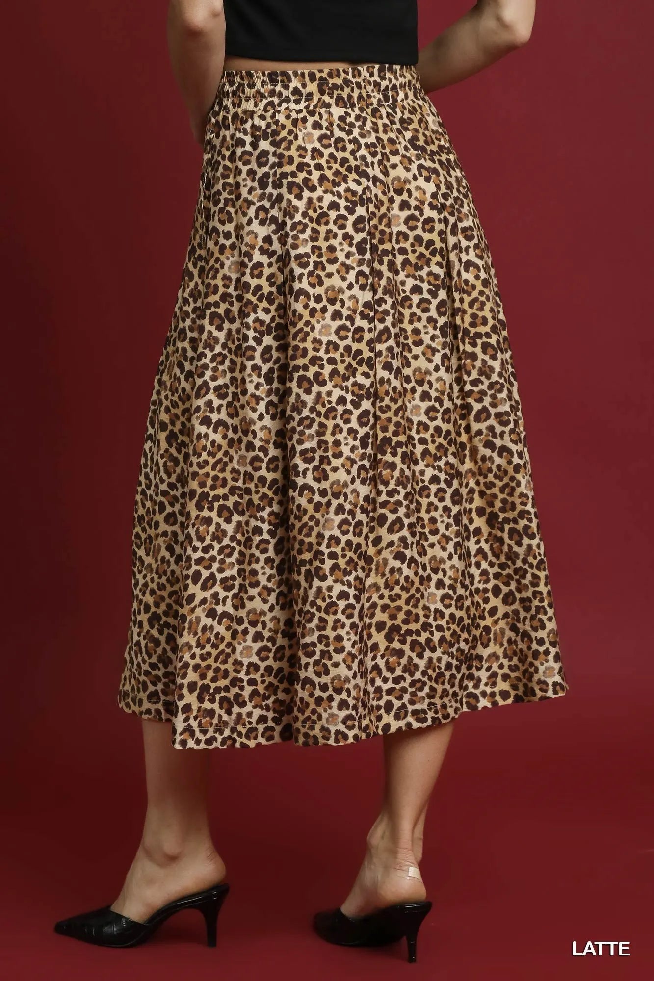 Umgee leopard midi skirt with drawstring waist, featuring a stylish animal print, perfect for casual or chic outfits.