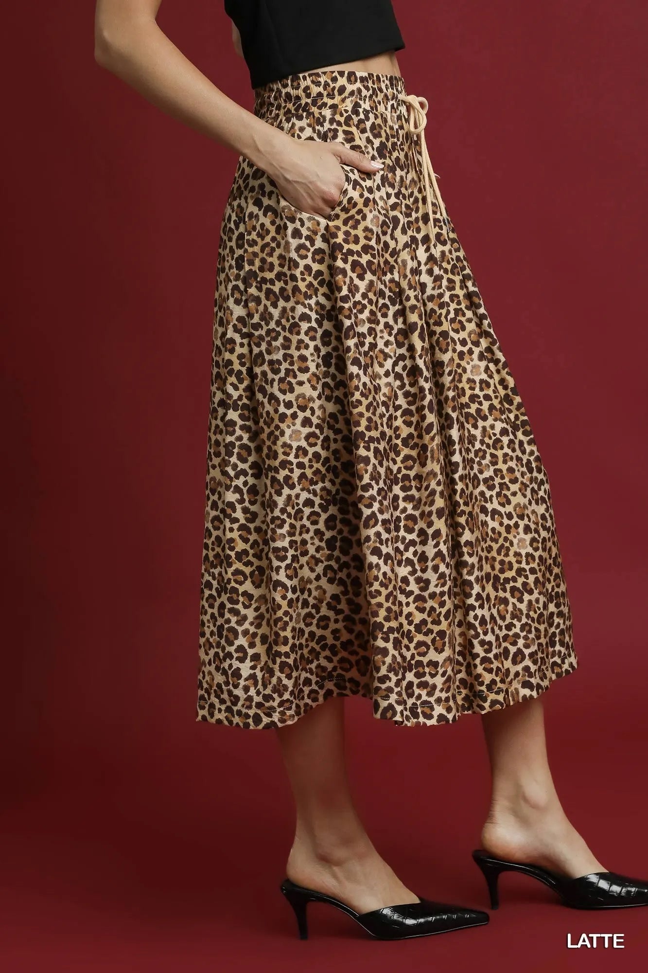Umgee leopard midi skirt with drawstring waist in latte color, featuring a stylish animal print and midi length.