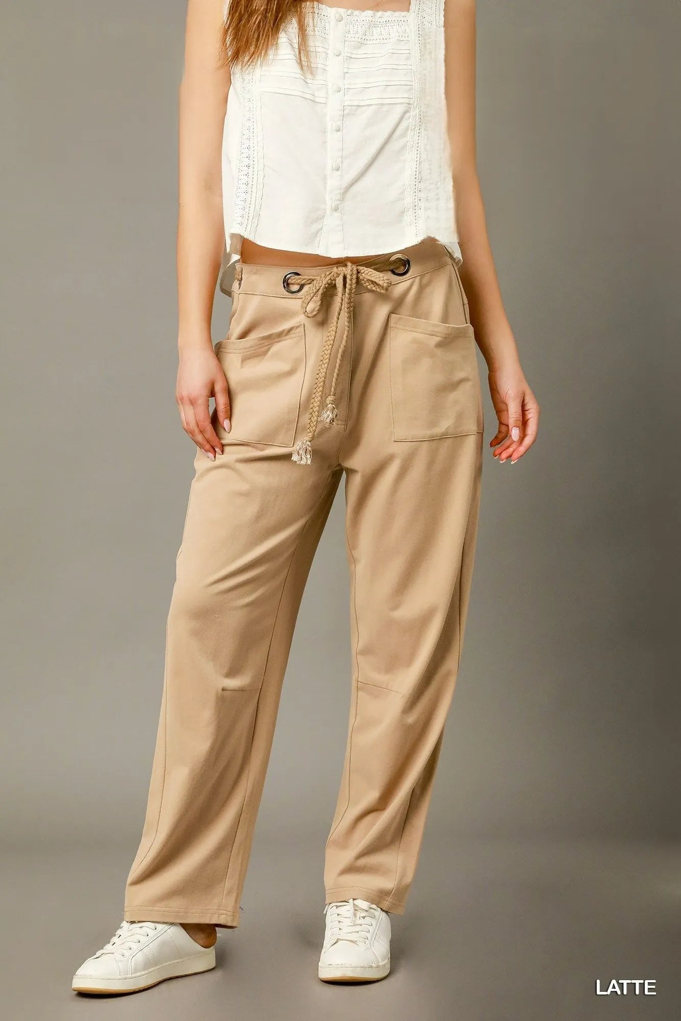 Light brown Umgee cargo-inspired drawstring pants with a relaxed fit and cargo pockets, styled for casual wear.