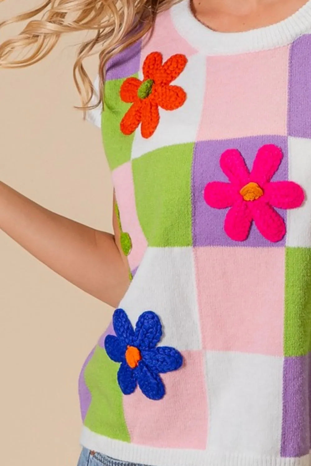 Lavender blush and lime checkered sweater vest with embroidered flower patches from Trendsi, casual and stylish for layered outfits.