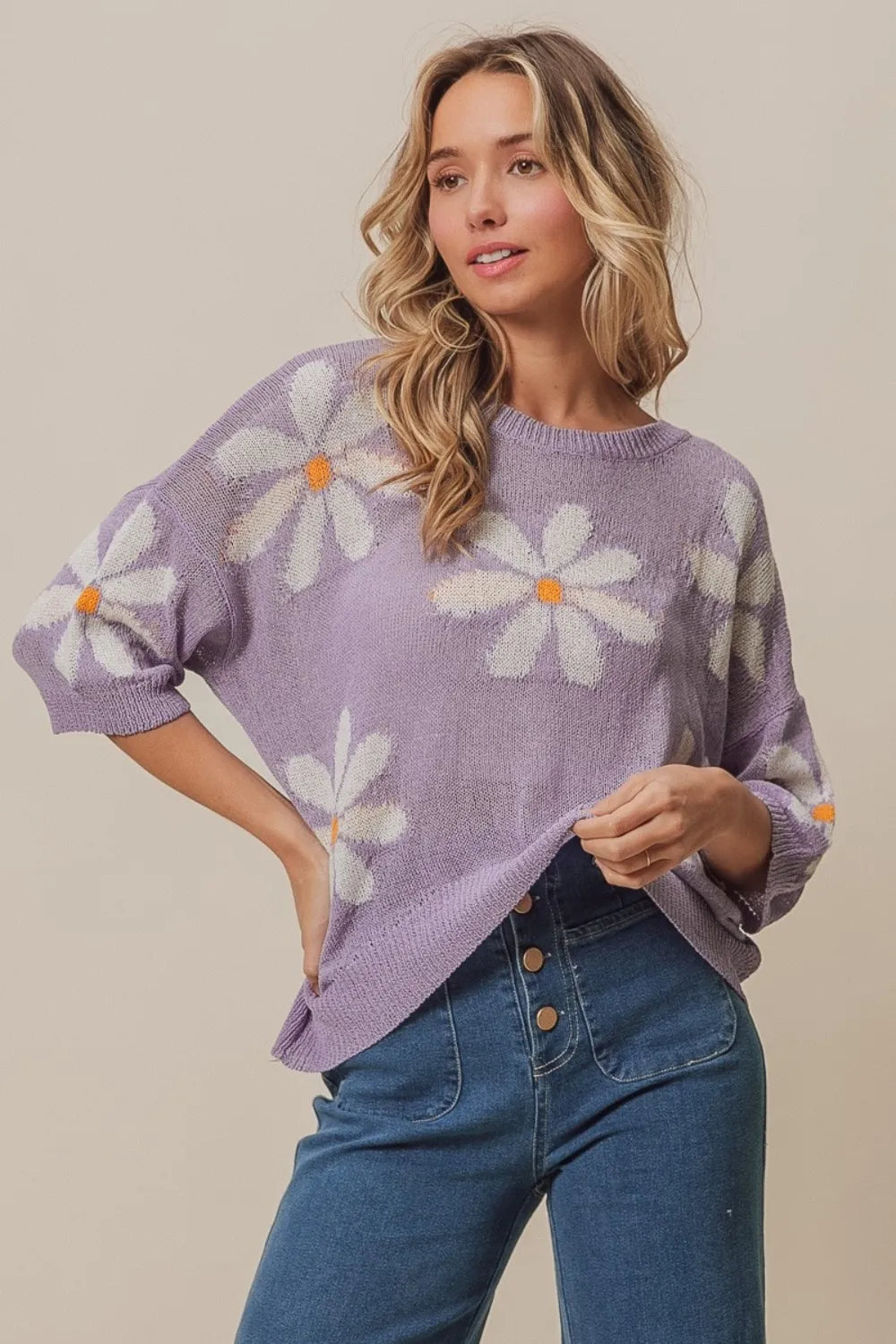 Lavender and ivory BiBi floral pattern slit sweater by Trendsi, featuring a cozy knit design and stylish side slits.