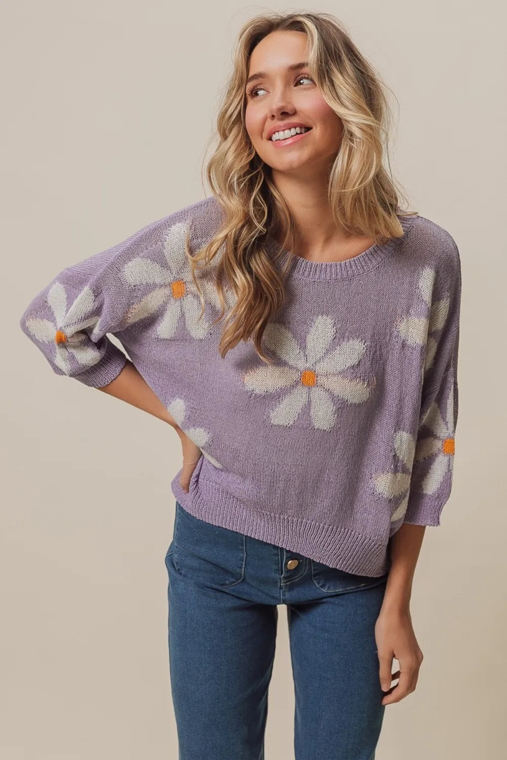 Lavender and ivory BiBi floral pattern slit sweater from Trendsi, featuring a cozy knit with floral design and stylish slit detail.