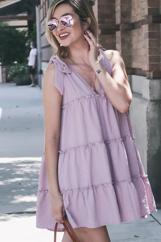 Lavender layered flounce ruffle dress with polka dot textured fabric from Trendsi, featuring a stylish and feminine design.