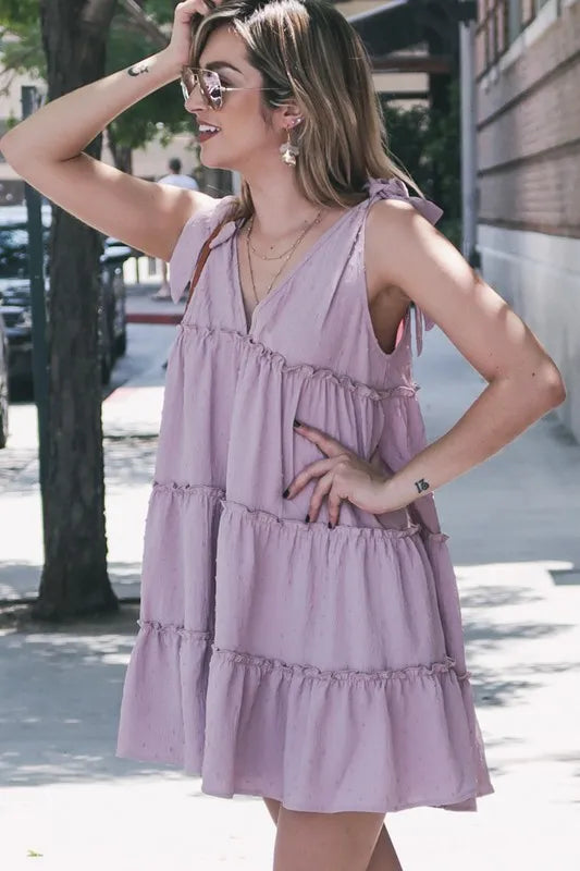 Lavender layered flounce dress with polka dot texture and ruffle details, by Trendsi, featuring a feminine and stylish design.