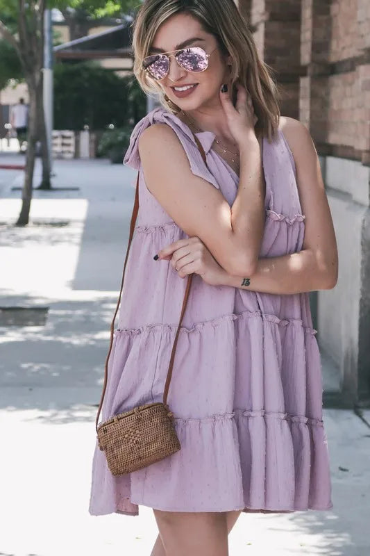 Lavender layered flounce dress with polka dot textured fabric and ruffle details, by Trendsi.