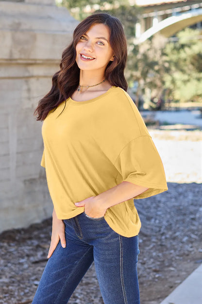 Lavender Basic Bae bamboo full-size round neck drop shoulder T-shirt by Trendsi, showcasing relaxed fit and soft fabric.