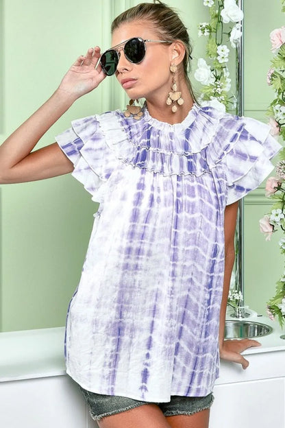 Lavender tie-dye ruffle neck top from BiBi by Trendsi featuring a tiered design and long sleeves.