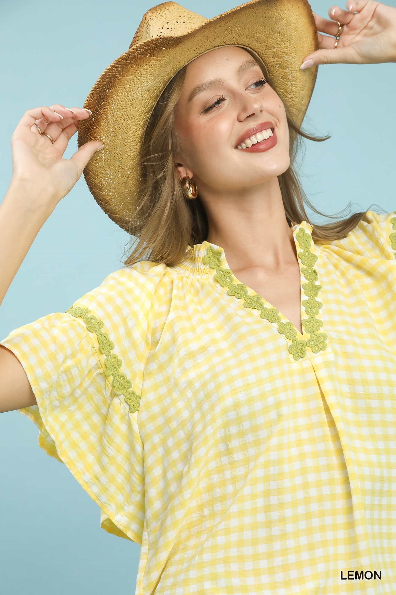 Lemon-colored Umgee Gingham Lace Trim Top with short sleeves and delicate lace details, stylish and lightweight for casual wear.