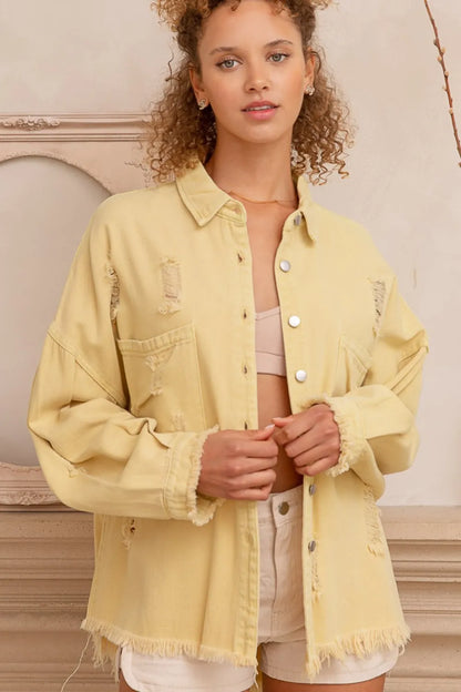 Trendsi lemon-colored button-down shacket with raw hem and distressed details, casual long-sleeve outerwear for layered style.