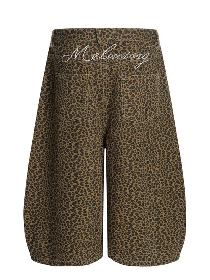Men's leopard print wide-leg capris by Trendsi featuring a bold animal pattern and relaxed fit, showcased on a mannequin.