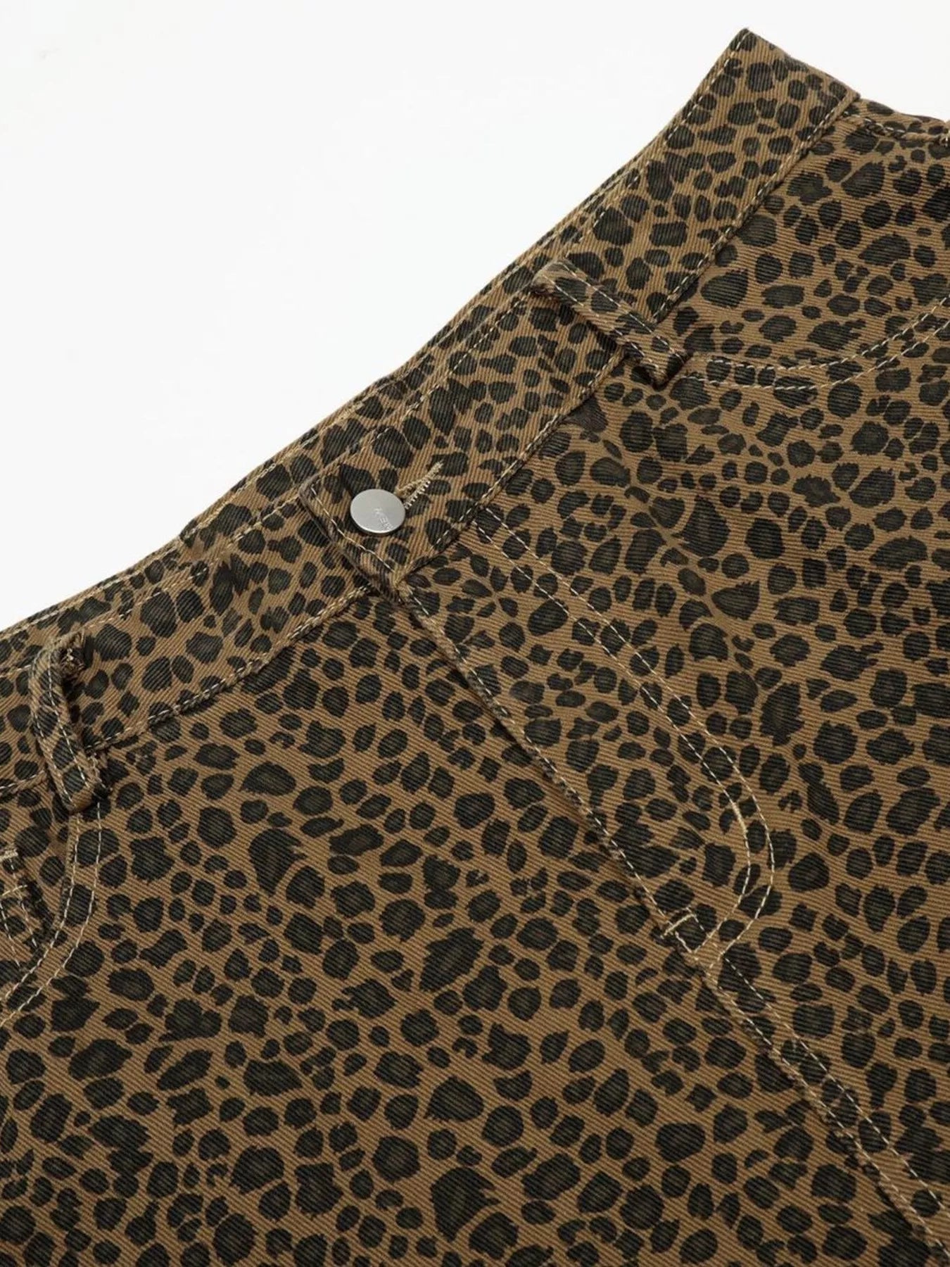 Men's leopard print wide-leg capris by Trendsi featuring bold animal pattern and relaxed fit, shown in a stylish casual setting.